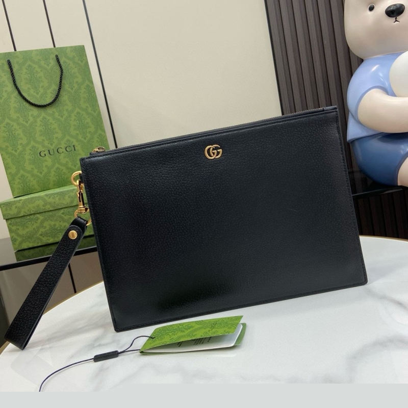 G*u*i clutch bags
